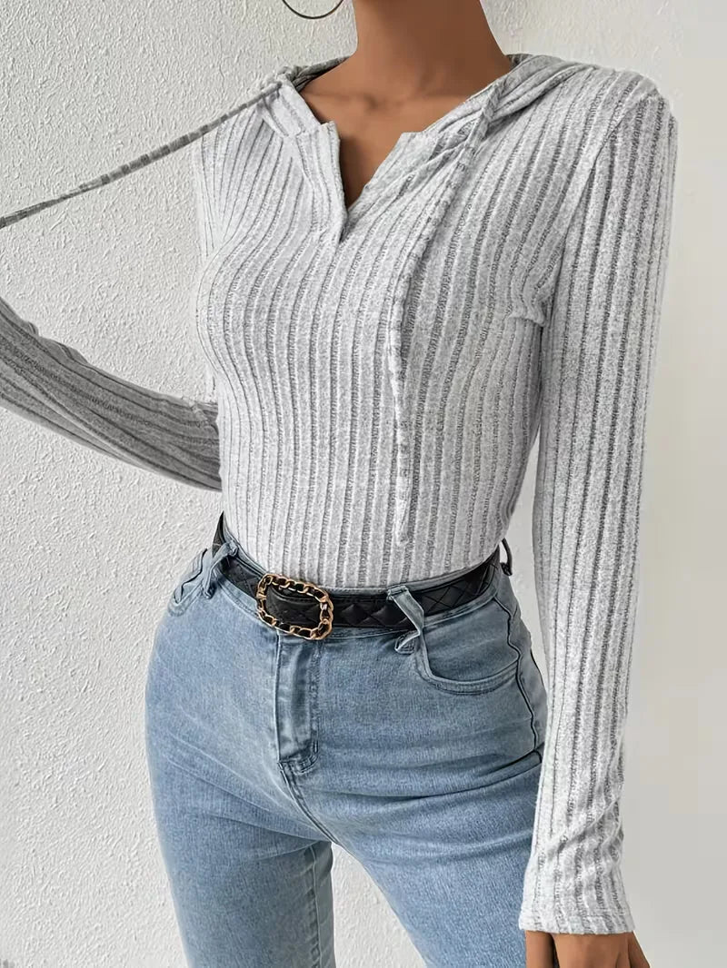 Bodysuit met capuchon en lange mouwen